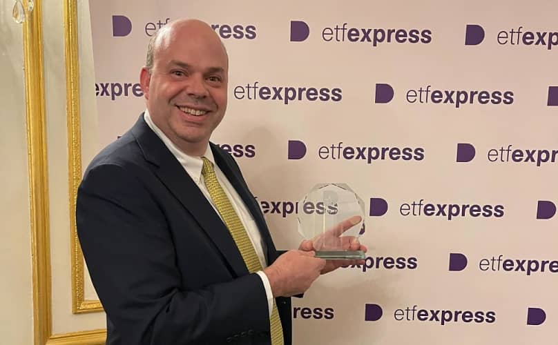 Todd Rosenbluth accepting ETF Express' 2022 Best ETF Research Award on behalf of VettaFi